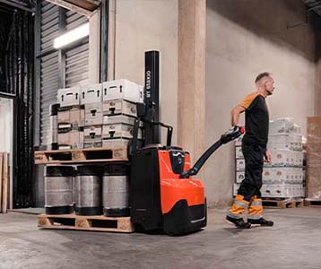 Toyota pedestrian pallet stacker unloading lorry