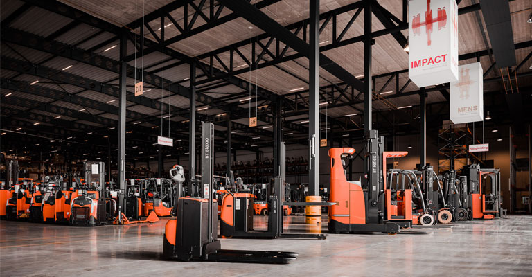 Used trucks in warehouse storage